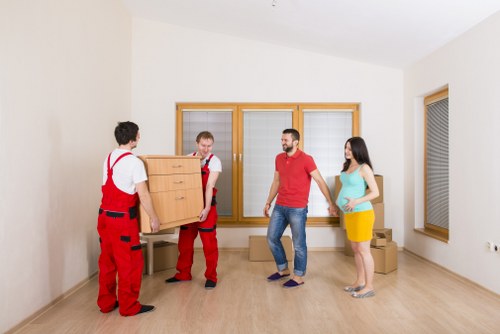 Specialist piano removal team preparing an upright piano move in Waterloo