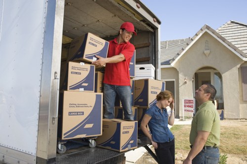Fragile household items being carefully wrapped for transport in Waterloo